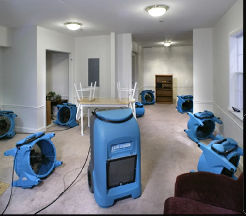 Air movers and dehumidifier setup for Water Damage Restoration in Alma
